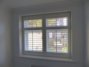 White Full Height Louvered Shutters With Central Control Rods