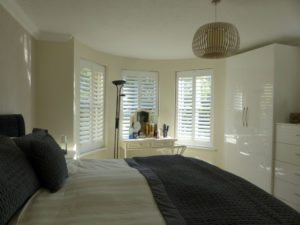 Three Angled Shutters In Bedroom Windows
