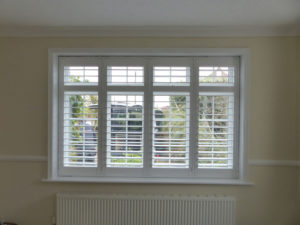 White Plantation Shutters With TPosts