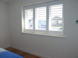 White Wooden Shutters With TPosts